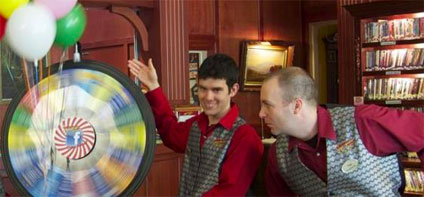 The crew gives the Prize Wheel a big spin.
