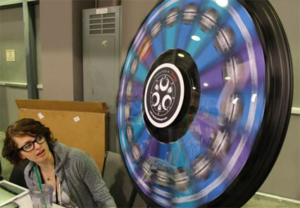 Katey watches the prize wheel spin.