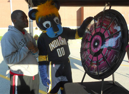 Mascot take a spin on the prize wheel.