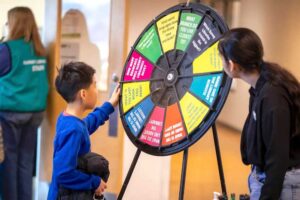 spinning a prize wheel from Surrey Libraries; it is customized to make a trivia wheel