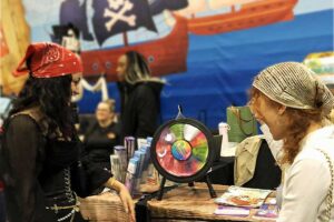 for this fair people were dressed up like pirates when spinning the wheel